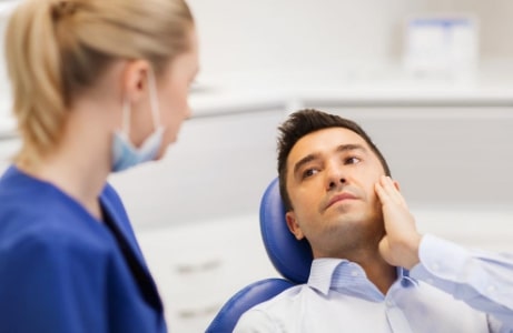 Emergency Dentist Manassas VA | Patient feeling pain.
