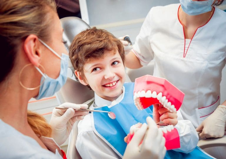 Pediatric Dentists Manassas VA | Happy kid getting his teeth cleaned.