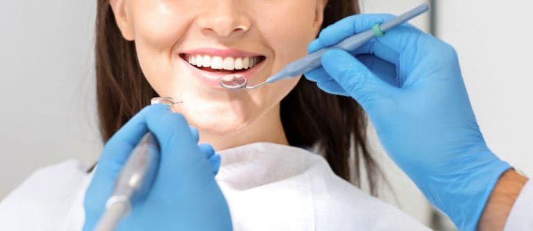 Manassas Best Dentists | Woman receiving dental checkup.