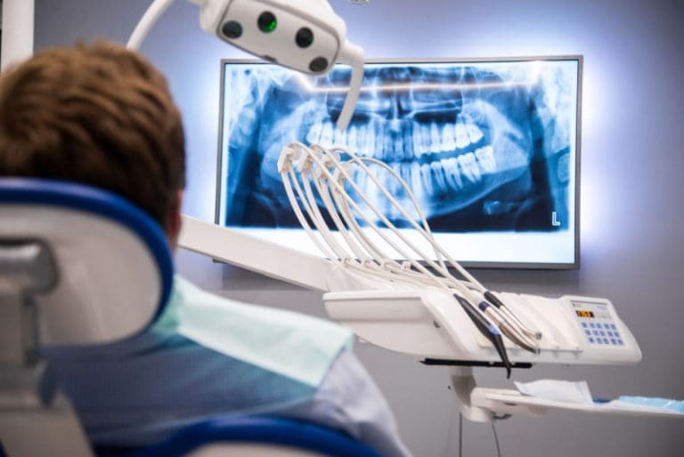 Tooth Decay Treatment | Patient looking at x-ray.