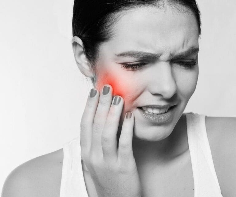 tooth pain | woman with tooth pain